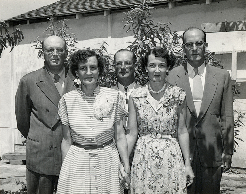 Vintage photography depicting family members and relationships within a shared space.